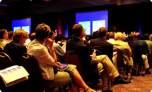 Delegates listening at a conference